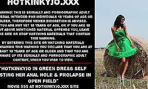 Hotkinkyjo in green dress self fisting her anal hole and prolapse in open field
